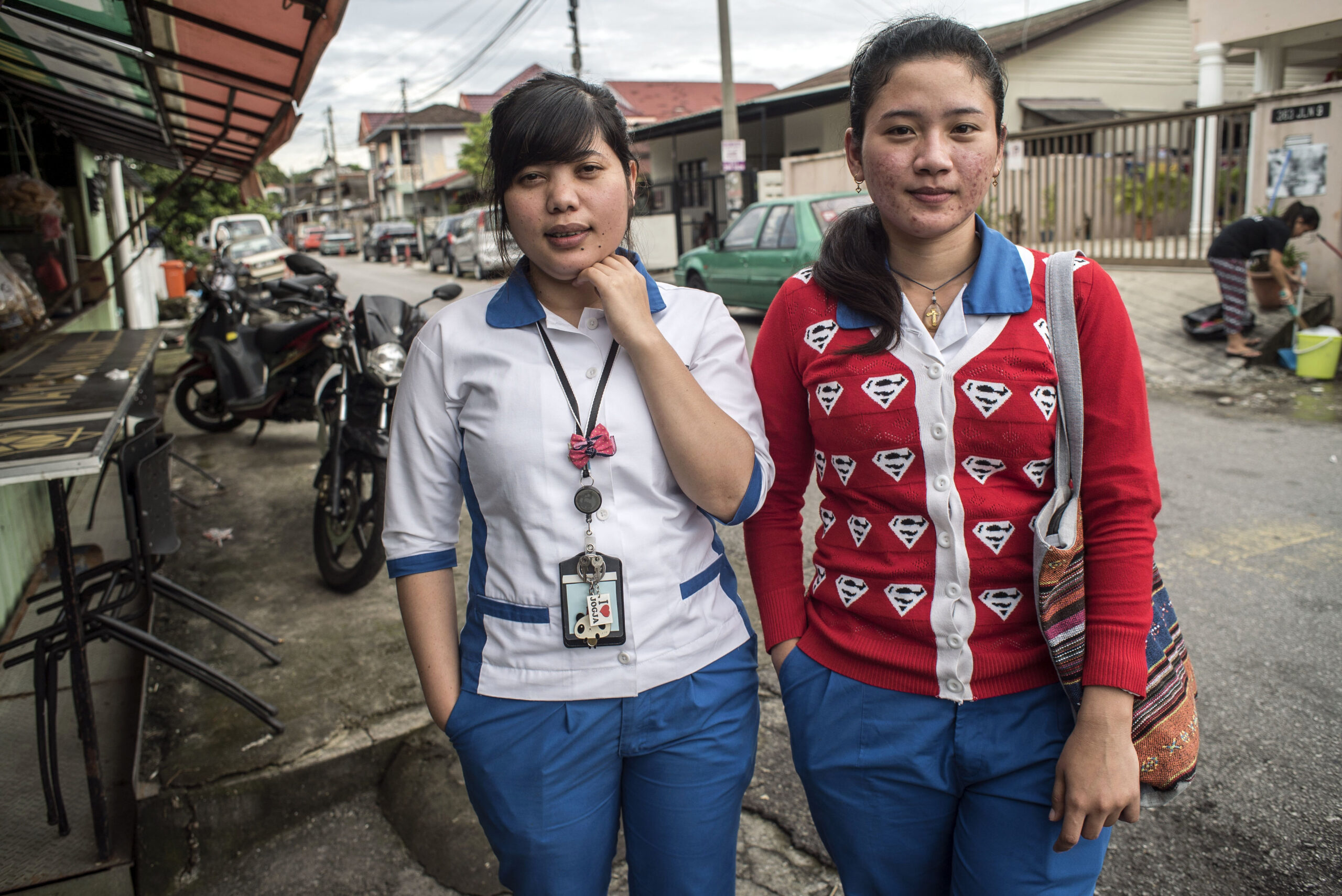two women migrant workers outside their job in Malaysia