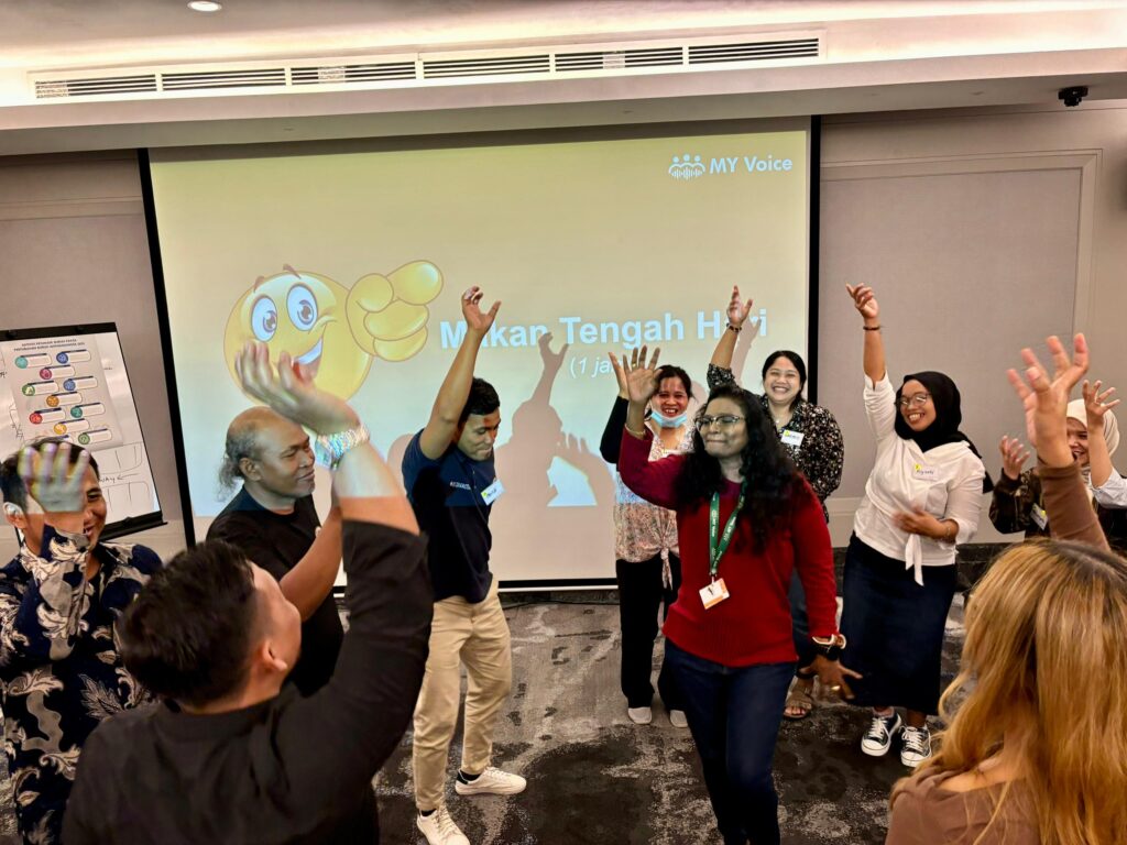 group of people dancing in a classroom